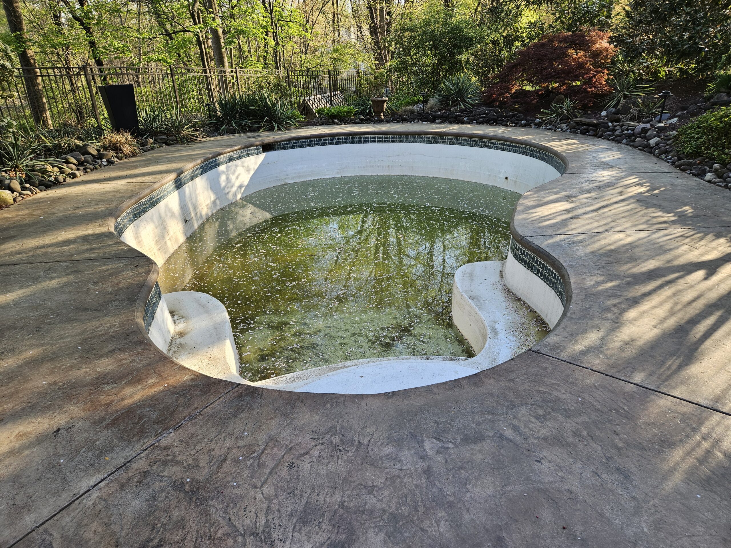 West Chester, PA Pool renovation new pebble plaster and tile