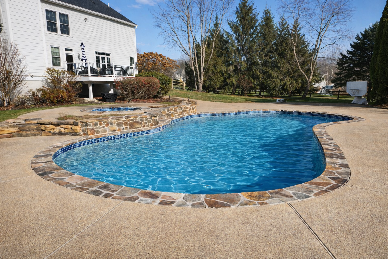 Malvern pa pool renovation with stone coping and retaining walls