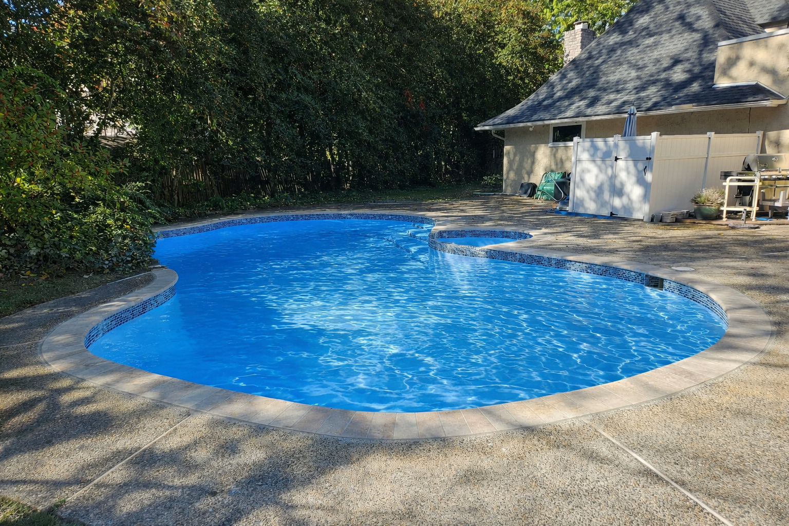 Wallingford PA pool renovation with travertine coping and updated tile